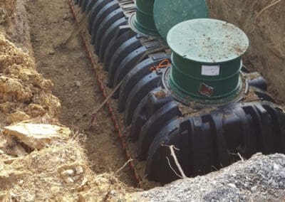 New septic tank lowered into place and ready to install