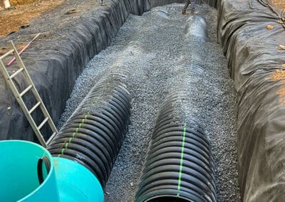 Workers covering pipes