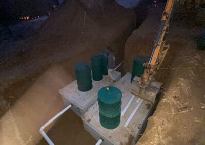 Working on a septic system during the night